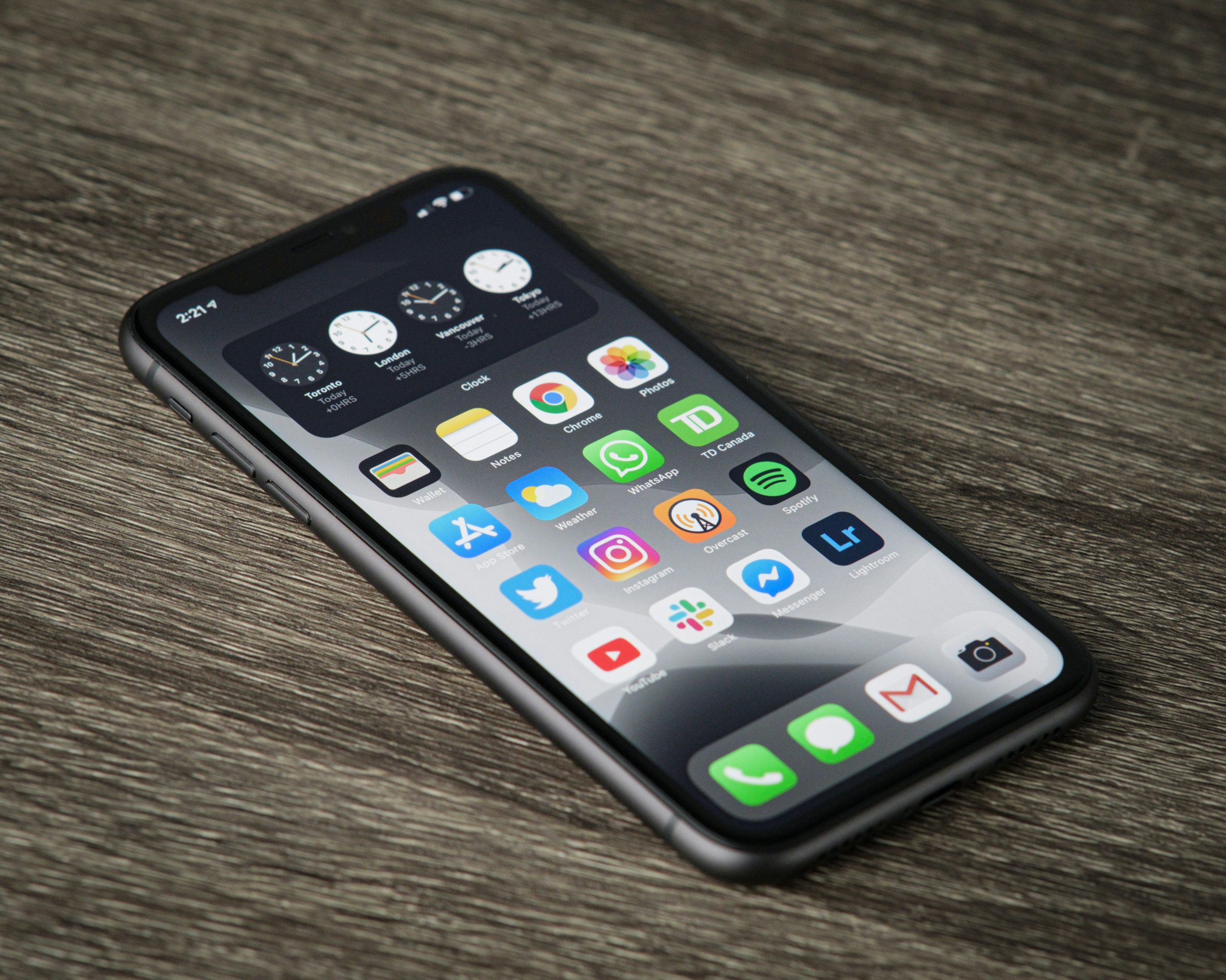 an iphone on a wooden table showing the app screen