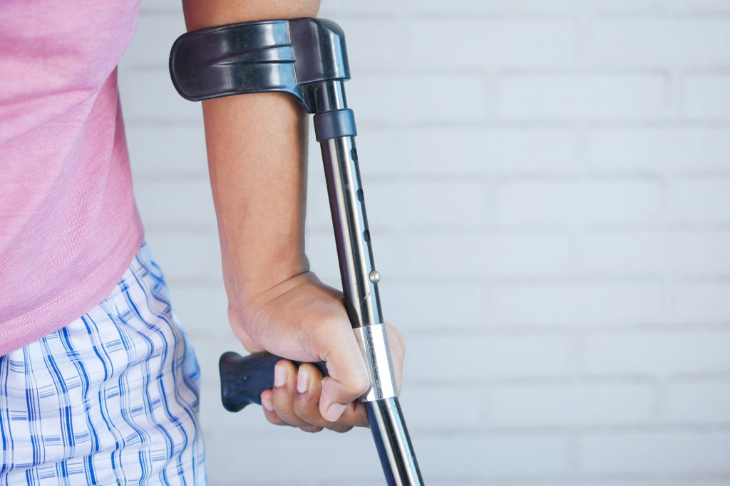 Image of the left hand in a forearm crutch of a person